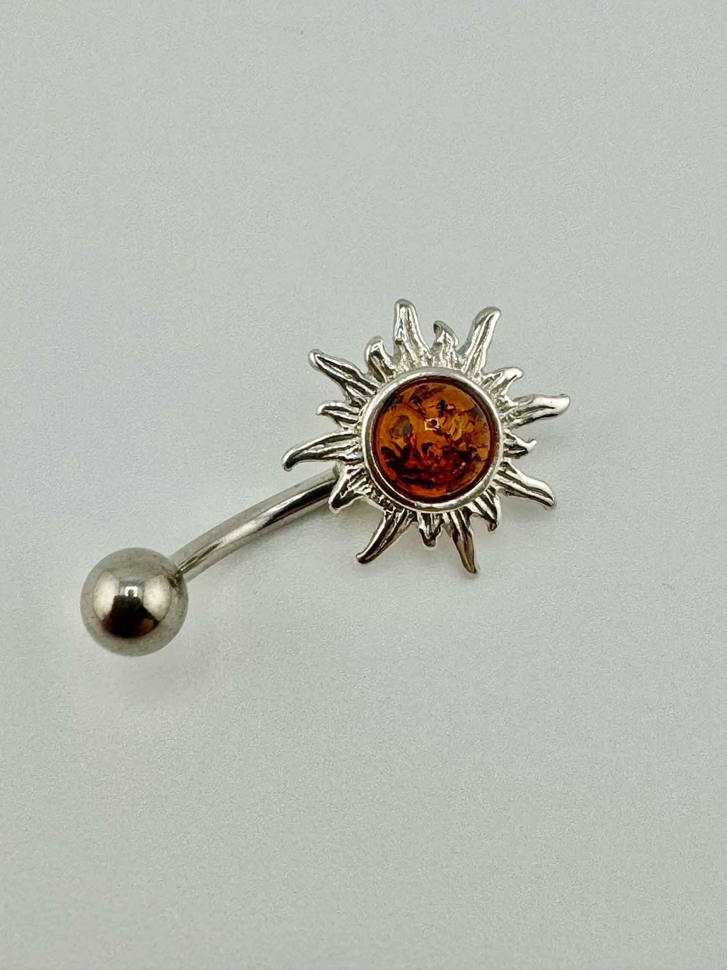 Sølv solpiercing med rav - unikt stykke