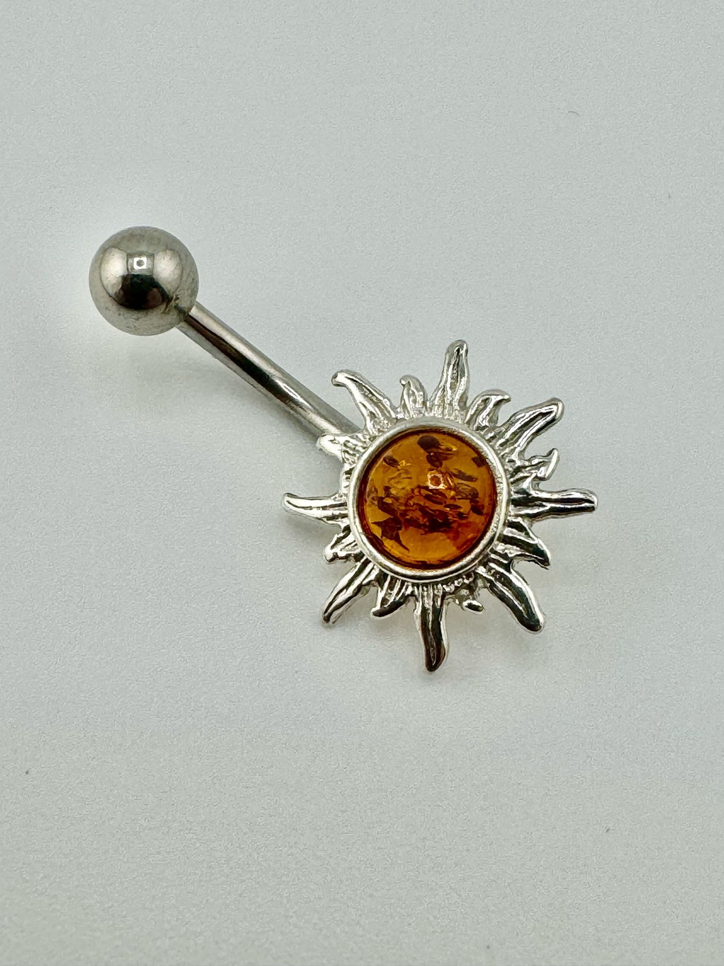 Sølv solpiercing med rav - unikt stykke